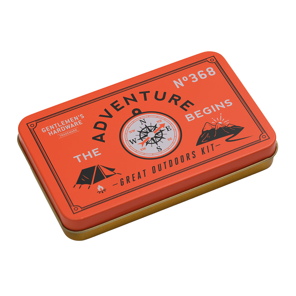 Orange tin box with 'Adventure Begins' and compass design on a white background