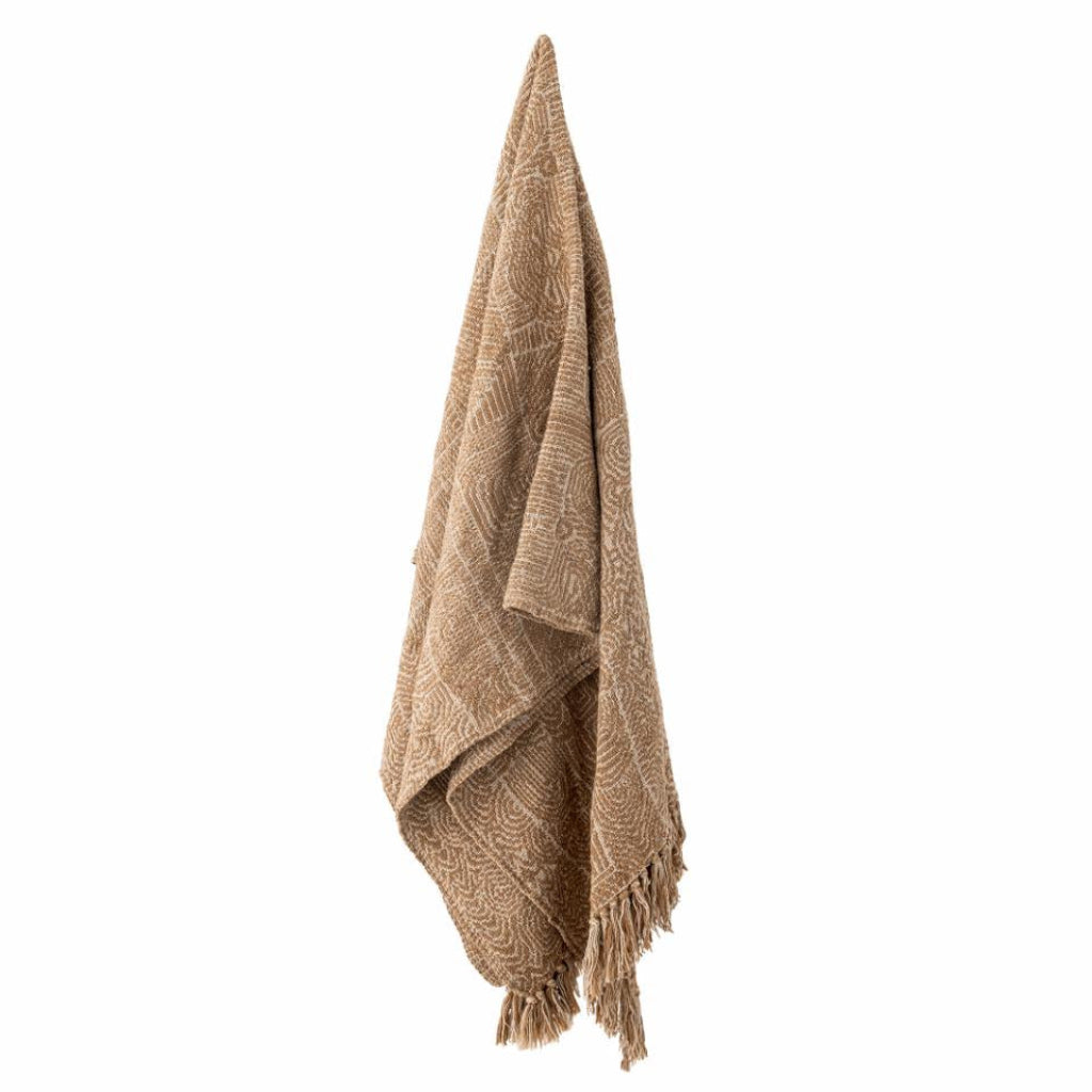Beige woven blanket with fringes on a white background