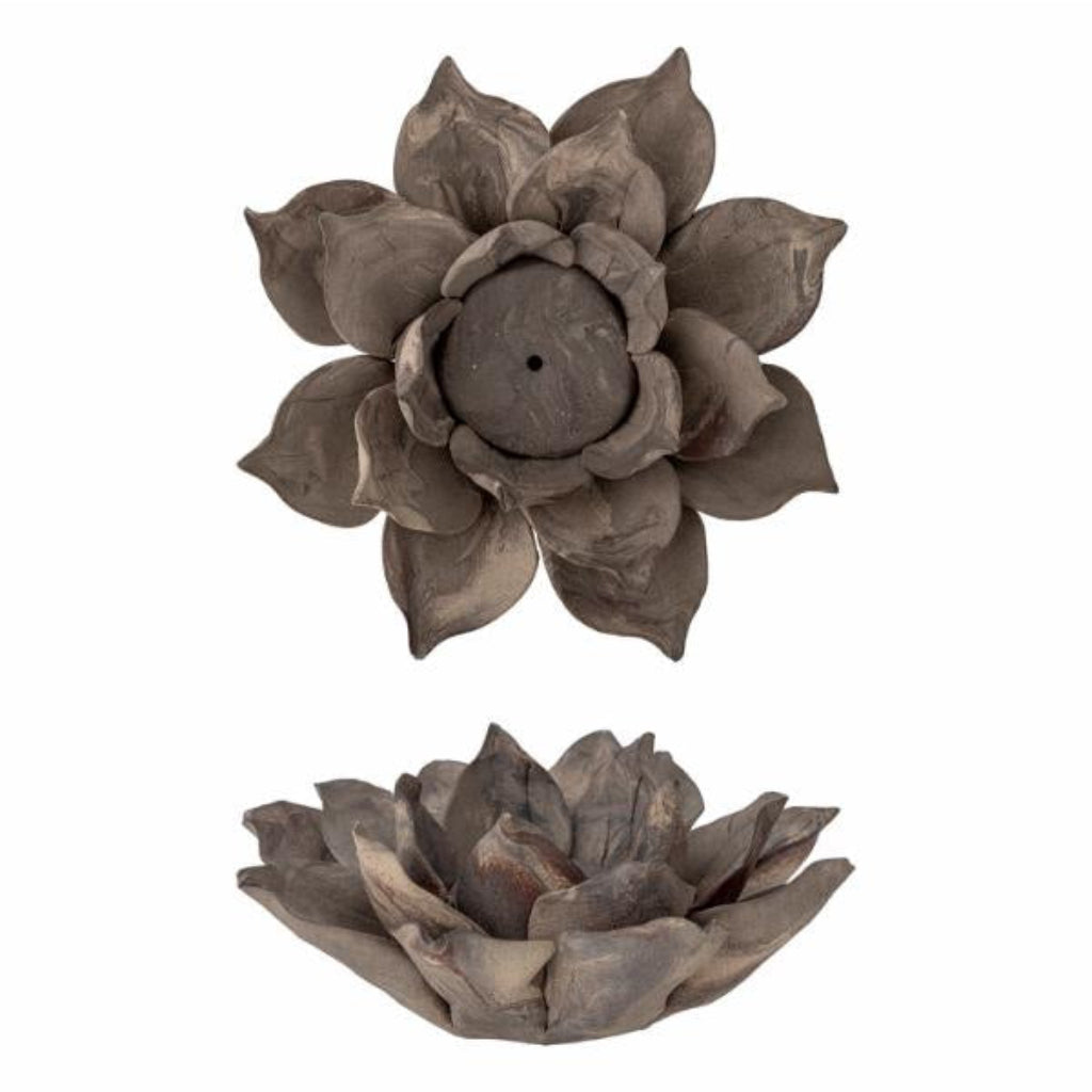 Two brown decorative votives shaped like flowers on a white background