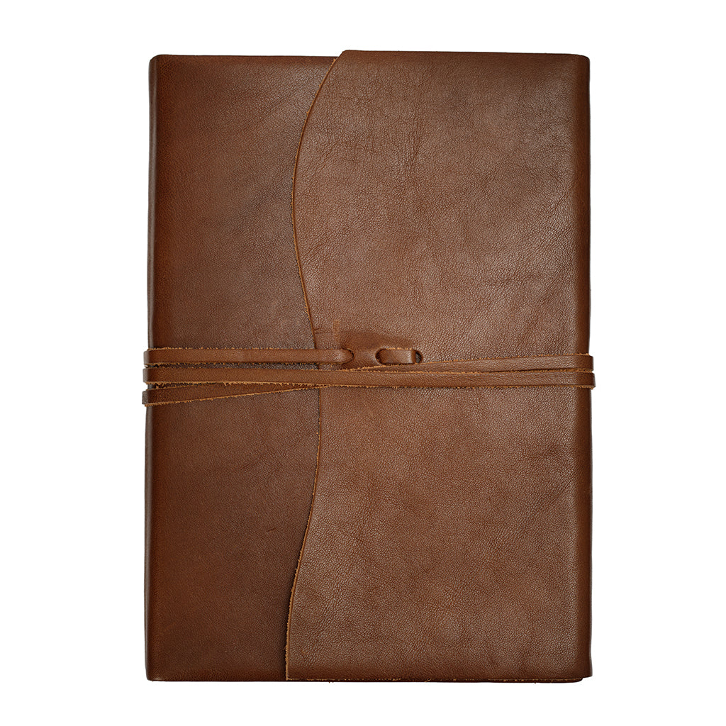 Brown leather notebook with a strap closure on a white background