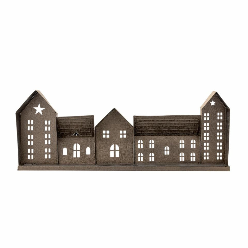 Decorative house model with cut-out windows on a white background