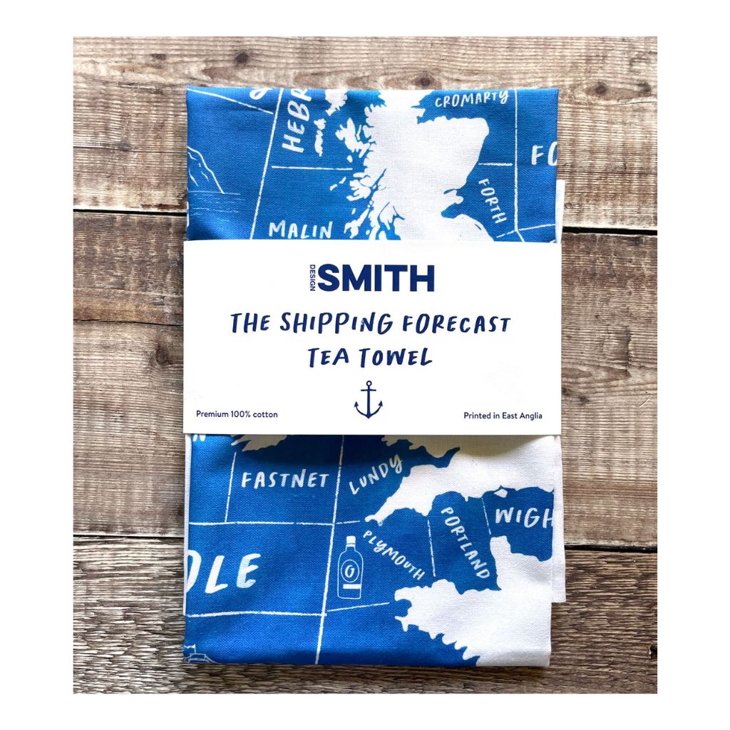 Shipping Forecast tea towel with map design on a wooden surface