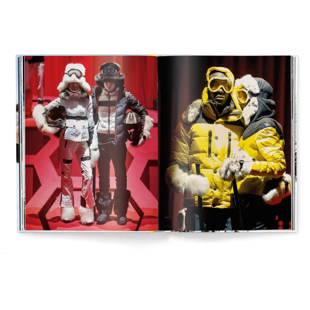 Book open to a page showing two people in winter clothing against red and black backgrounds.
