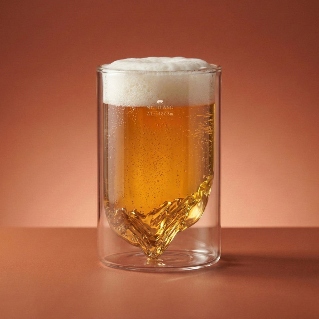 Clear glass filled with beer on a brown background