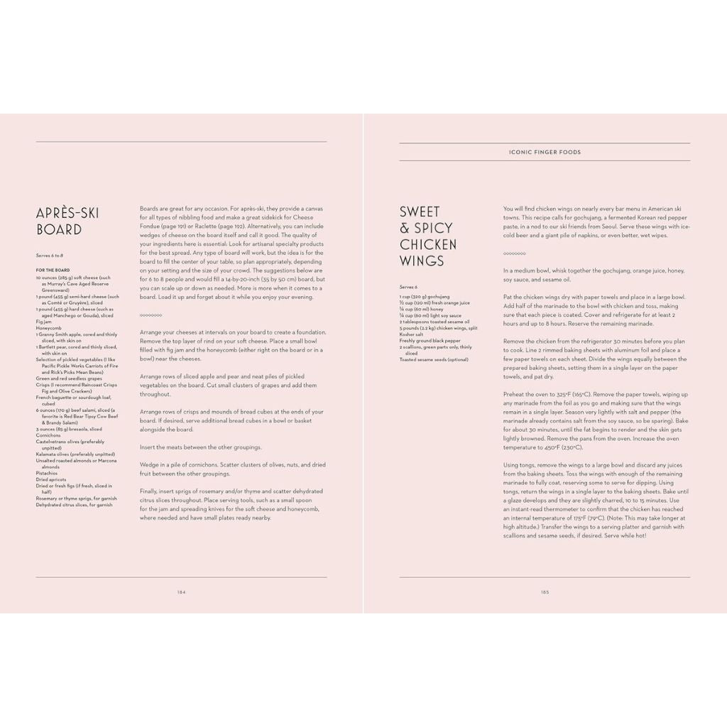 Open book showing a recipe for sweet and spicy chicken wings on a pink background
