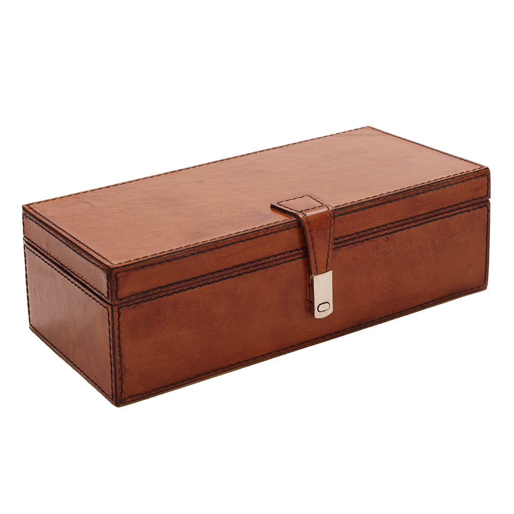 Brown leather jewellery box with a strap on a white background