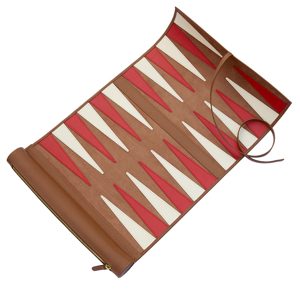 A brown leather backgammon case shown open, featuring alternating red and cream-coloured playing points on a plain white background.