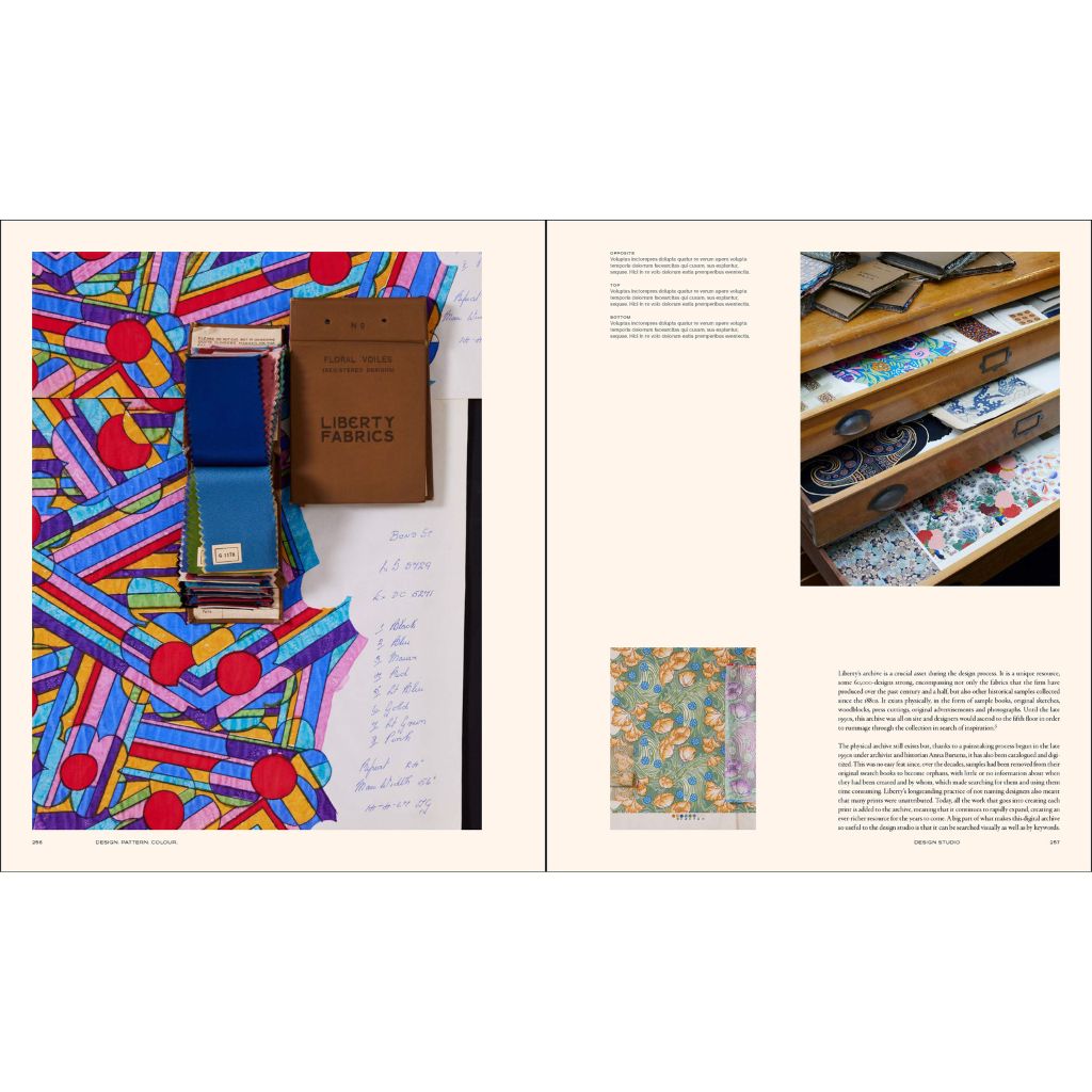 Open book showing fabric samples and a display case with fabrics.