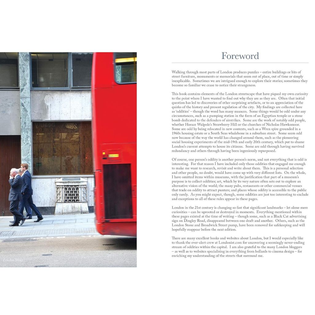 Red double-decker bus on a city street with text on the right side.