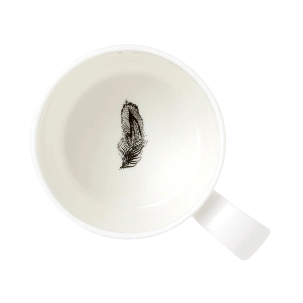Feather inside mug