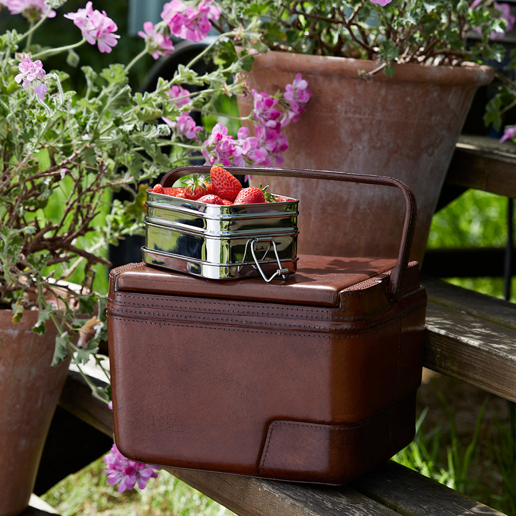 Leather Cool Box Closed  shown with tub of strawberries sitting on top